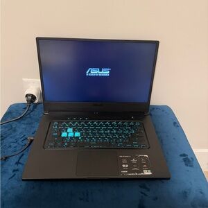 ASUS Black Laptop with Teal Backlit Keyboard